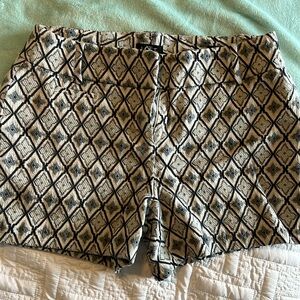 Loft size 2 shorts, 2 inch inseam. Does have a little stretch in material